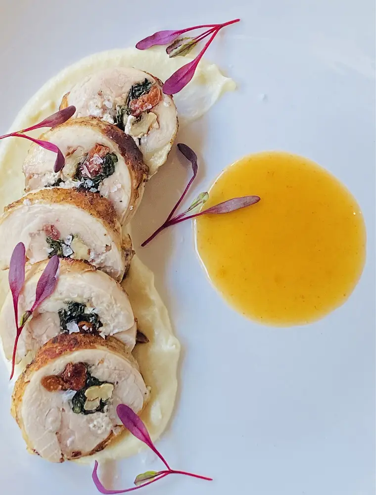 Gourmet chicken with garnish and sauce