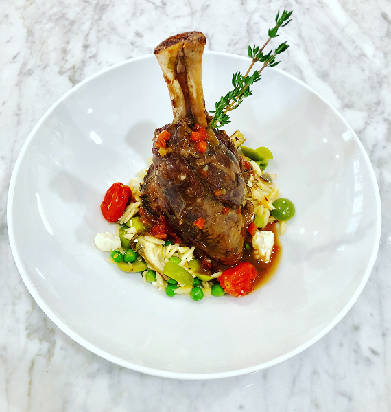 Lamb shank with vegetables and herbs