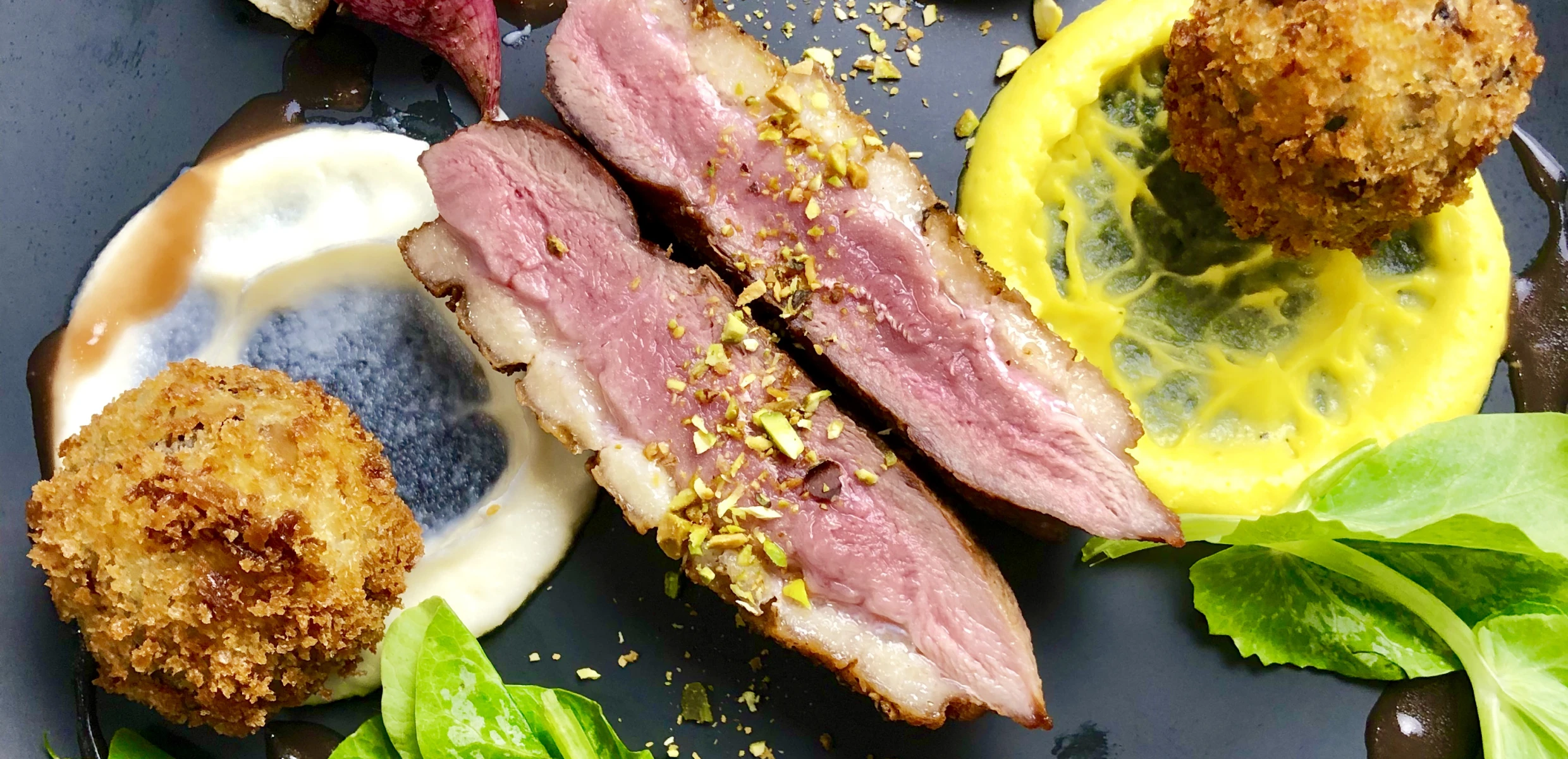 Elegant plated duck with lemon slice