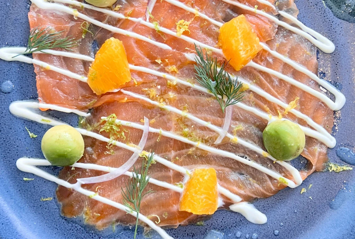 Salmon carpaccio with orange and avocado